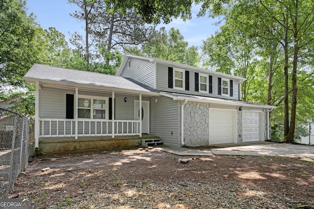 2894 Cushing Ct, Jonesboro, GA 30236 - view of front of home featuring covered porch, driveway, and a shingled roof