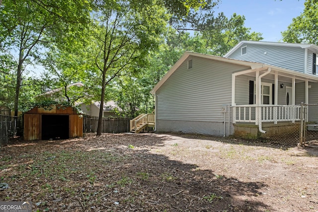 2894 Cushing Ct, Jonesboro, GA 30236 - view of home's exterior featuring a porch, an outdoor structure, and stairs