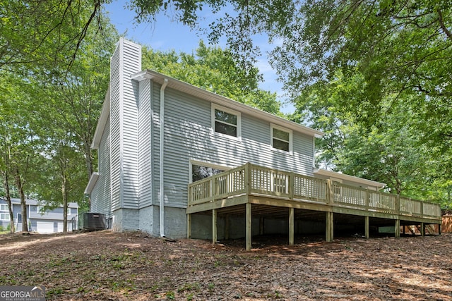 2894 Cushing Ct, Jonesboro, GA 30236 - back of house featuring a wooden deck, a chimney, and central AC