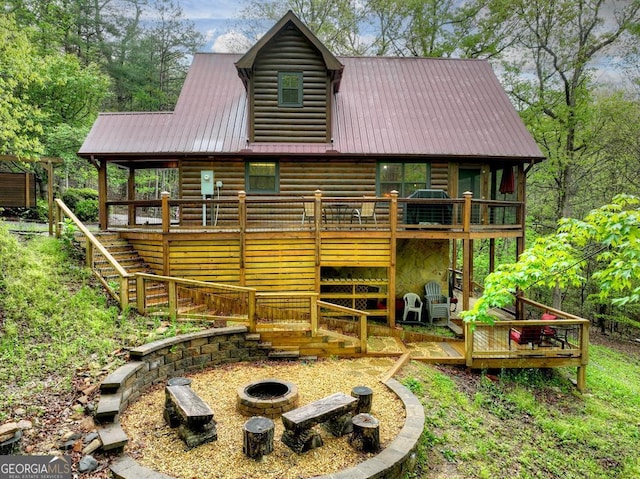 294 Oakwood Trl, Mineral Bluff, GA 30559 - back of house with an outdoor fire pit, stairway, metal roof, and a deck