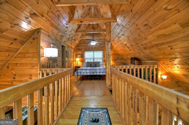 294 Oakwood Trl, Mineral Bluff, GA 30559 - hallway featuring vaulted ceiling, wood ceiling, an upstairs landing, light wood-style flooring, and wood walls