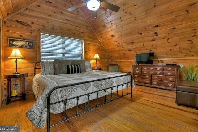 294 Oakwood Trl, Mineral Bluff, GA 30559 - bedroom with lofted ceiling, wood walls, wood finished floors, wood ceiling, and ceiling fan