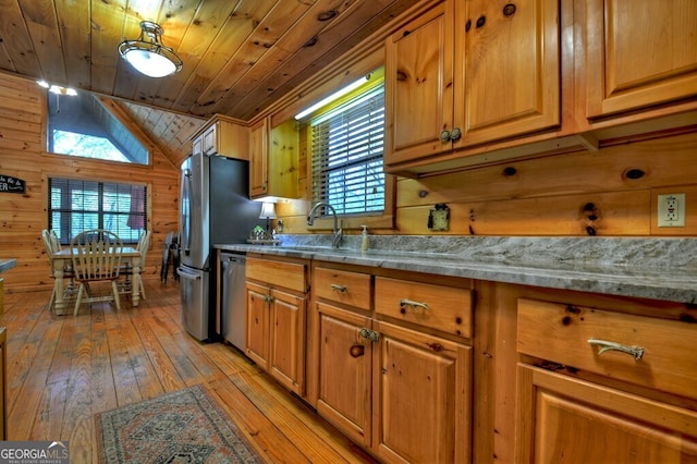 294 Oakwood Trl, Mineral Bluff, GA 30559 - kitchen featuring a sink, stainless steel dishwasher, wooden ceiling, light wood-style flooring, and wood walls