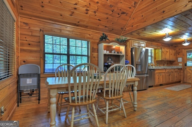 294 Oakwood Trl, Mineral Bluff, GA 30559 - dining room with light wood-type flooring, wood ceiling, and wooden walls