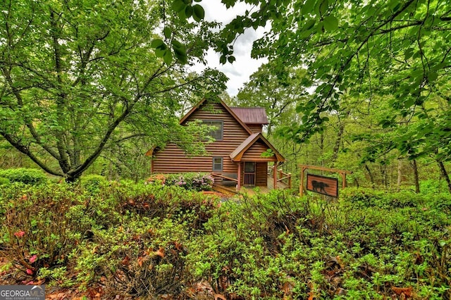 294 Oakwood Trl, Mineral Bluff, GA 30559 - view of front of house with faux log siding and metal roof