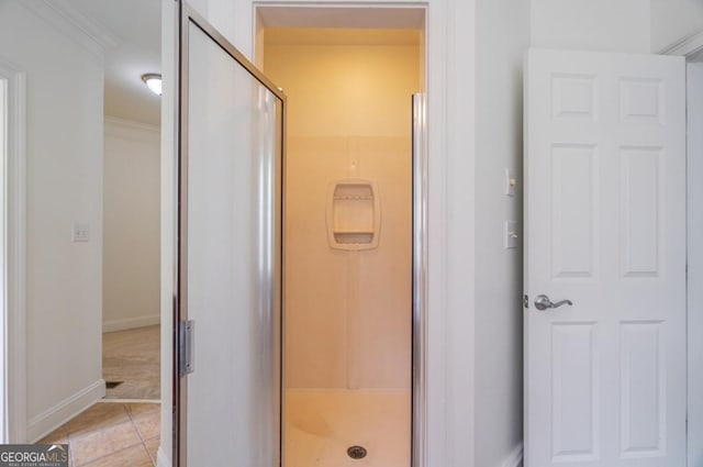 5620 Barnett Shoals Rd, Athens, GA 30605 - bathroom featuring a shower stall, crown molding, and tile patterned flooring