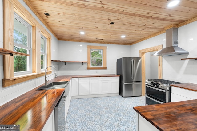 107 S Mulberry St, Statesboro, GA 30458 - kitchen featuring wooden counters, appliances with stainless steel finishes, wooden ceiling, open shelves, and wall chimney range hood