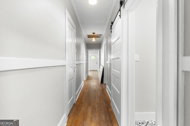 107 S Mulberry St, Statesboro, GA 30458 - hall featuring a barn door and dark wood-style flooring