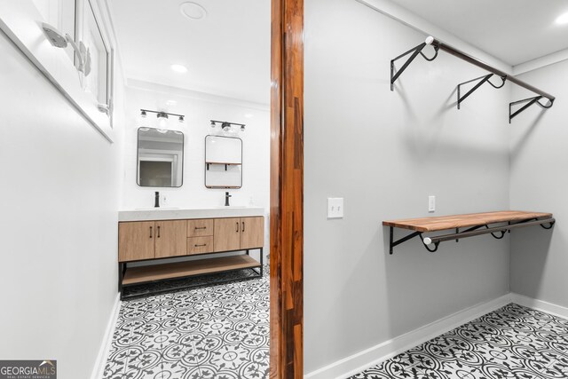 107 S Mulberry St, Statesboro, GA 30458 - walk in closet featuring light tile patterned floors and a sink