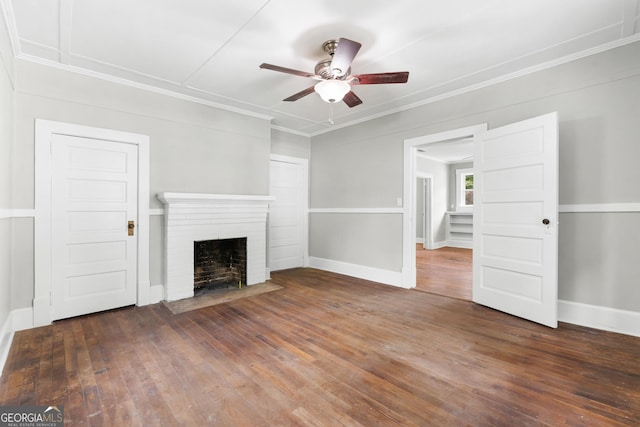 107 S Mulberry St, Statesboro, GA 30458 - unfurnished living room featuring a ceiling fan, a brick fireplace, hardwood / wood-style floors, ornamental molding, and baseboards