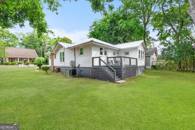 107 S Mulberry St, Statesboro, GA 30458 - rear view of house featuring a lawn, a wooden deck, stairway, and crawl space