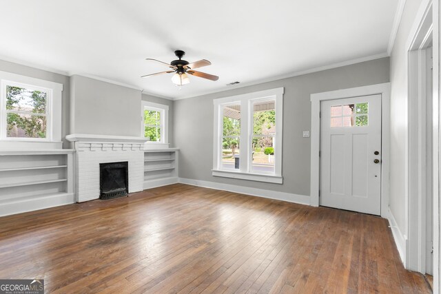 107 S Mulberry St, Statesboro, GA 30458 - unfurnished living room with plenty of natural light, a ceiling fan, wood-type flooring, a fireplace, and ornamental molding