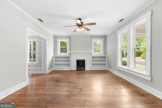 107 S Mulberry St, Statesboro, GA 30458 - unfurnished living room with ornamental molding, wood-type flooring, ceiling fan, and a brick fireplace