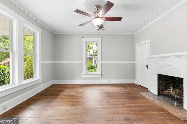 107 S Mulberry St, Statesboro, GA 30458 - unfurnished living room with hardwood / wood-style floors, crown molding, a ceiling fan, and a fireplace