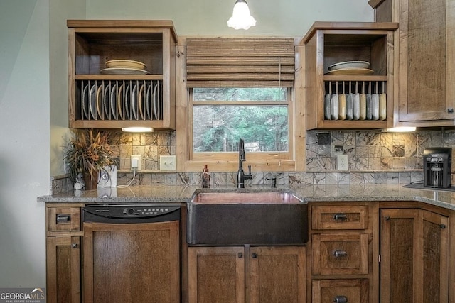477 Bootlegger Rd, Morganton, GA 30560 - kitchen featuring dishwasher, a sink, tasteful backsplash, brown cabinets, and light stone counters