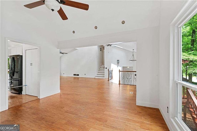 3007 Manning Dr, Marietta, GA 30062 - unfurnished living room featuring a ceiling fan, light wood-type flooring, baseboards, and stairway