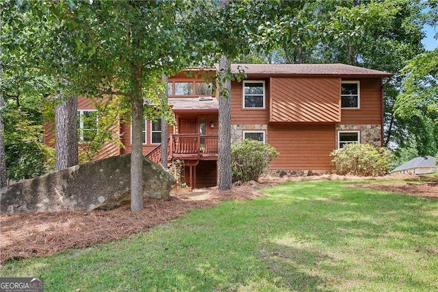 3007 Manning Dr, Marietta, GA 30062 - back of property featuring a lawn and stone siding