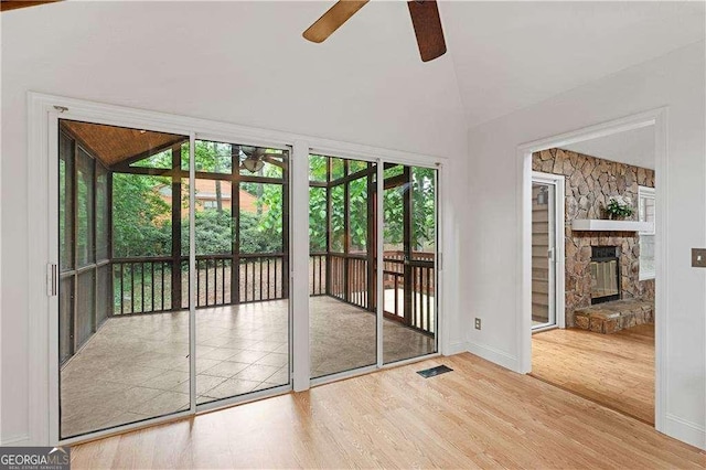 3007 Manning Dr, Marietta, GA 30062 - doorway with ceiling fan, wood finished floors, vaulted ceiling, baseboards, and a fireplace