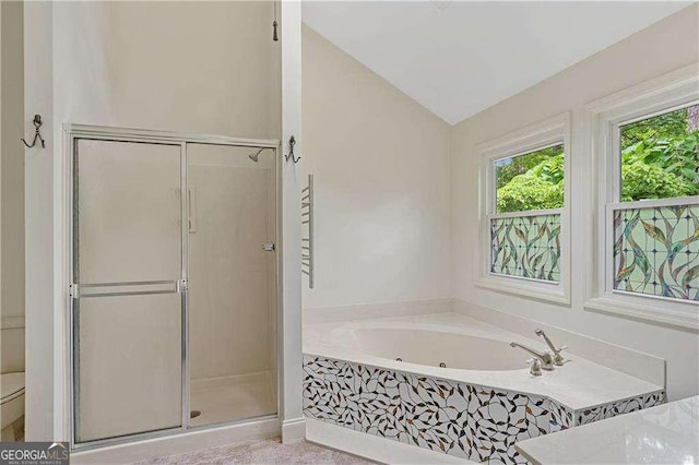 3007 Manning Dr, Marietta, GA 30062 - bathroom with a shower stall, a bath, and vaulted ceiling