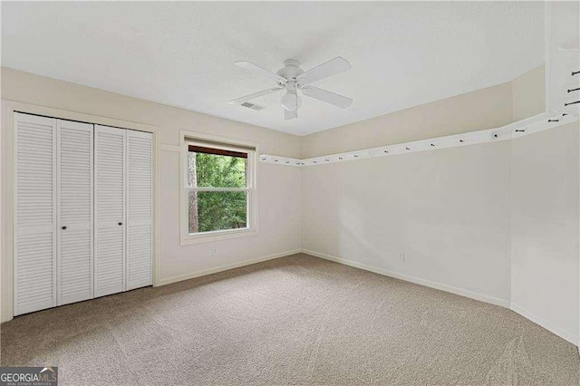 3007 Manning Dr, Marietta, GA 30062 - unfurnished bedroom featuring carpet floors, a closet, baseboards, and ceiling fan
