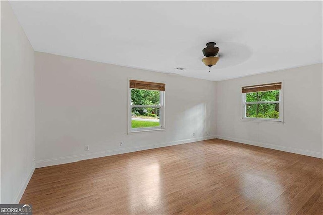 3007 Manning Dr, Marietta, GA 30062 - unfurnished room featuring healthy amount of natural light, wood finished floors, and baseboards