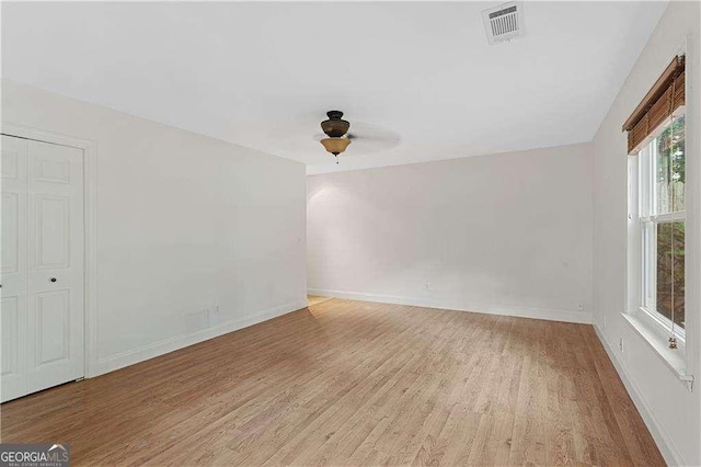3007 Manning Dr, Marietta, GA 30062 - unfurnished room with light wood-style floors, ceiling fan, and baseboards