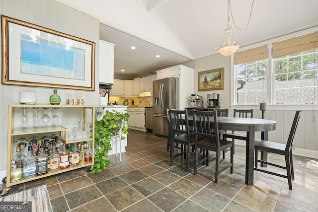 3734 Powers Ferry Rd NW, Atlanta, GA 30342 - dining space featuring stone tile floors, vaulted ceiling, recessed lighting, and ornamental molding