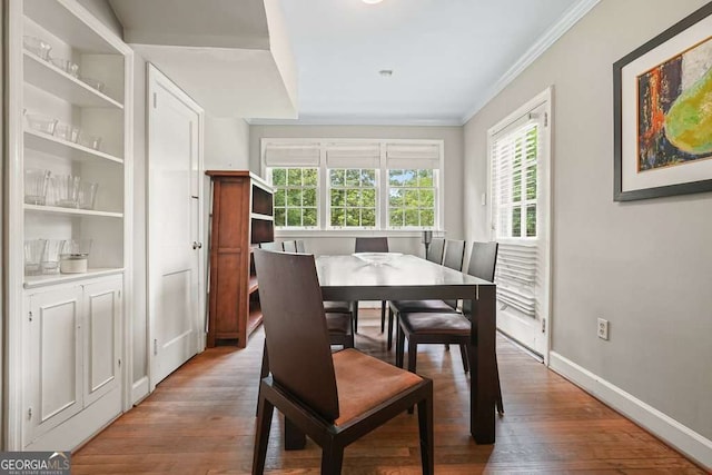 3734 Powers Ferry Rd NW, Atlanta, GA 30342 - dining space featuring ornamental molding, wood finished floors, and baseboards