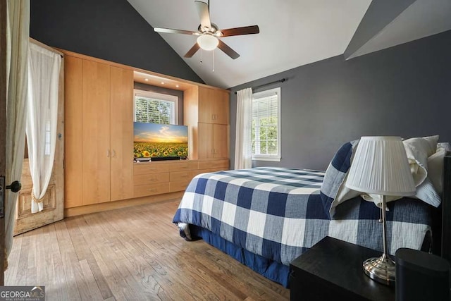 3734 Powers Ferry Rd NW, Atlanta, GA 30342 - bedroom with vaulted ceiling, light wood finished floors, and a ceiling fan