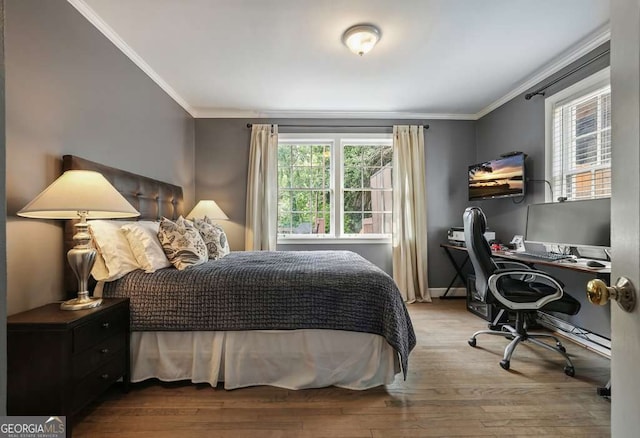 3734 Powers Ferry Rd NW, Atlanta, GA 30342 - bedroom with ornamental molding, multiple windows, wood finished floors, a desk, and baseboards