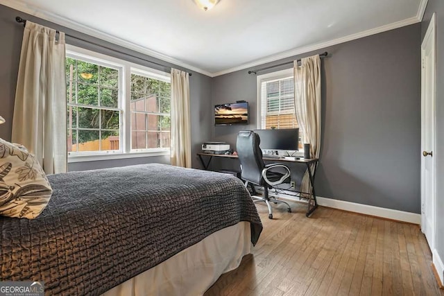 3734 Powers Ferry Rd NW, Atlanta, GA 30342 - bedroom with multiple windows, hardwood / wood-style floors, baseboards, ornamental molding, and a desk