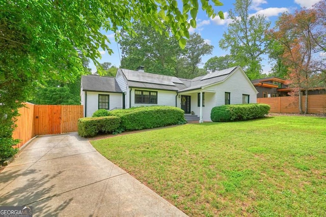 3734 Powers Ferry Rd NW, Atlanta, GA 30342 - view of front of property with solar panels, a gate, driveway, and roof with shingles