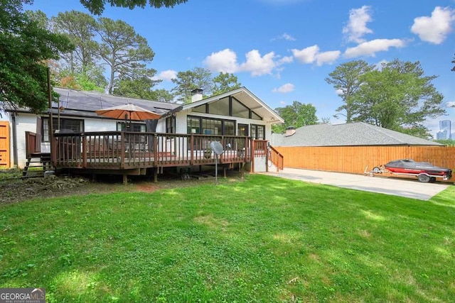 3734 Powers Ferry Rd NW, Atlanta, GA 30342 - back of house featuring a wooden deck, a sunroom, a garage, and a chimney