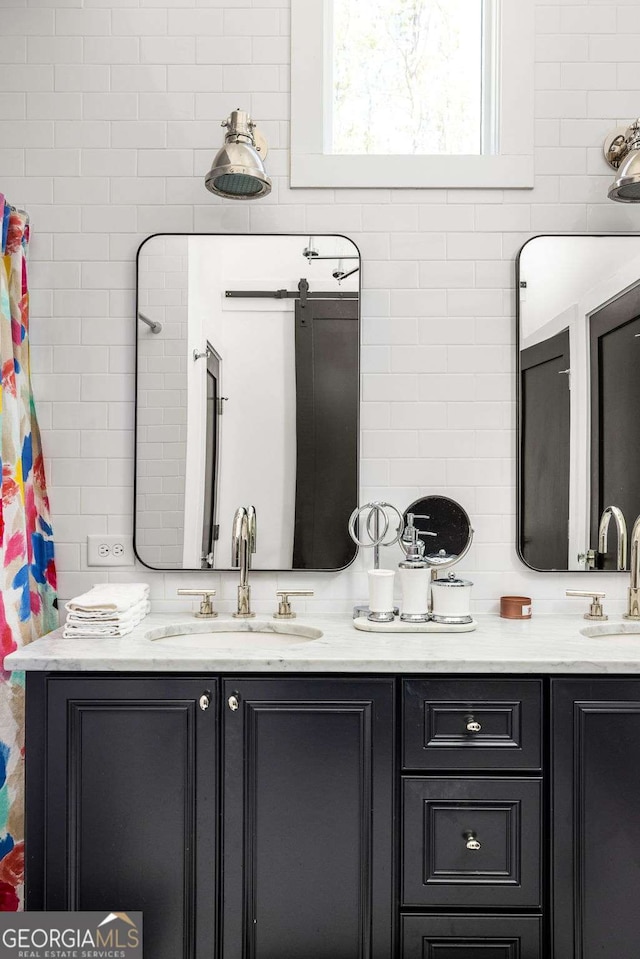 135 Mado Ln, Chattahoochee Hills, GA 30268 - bathroom with double vanity and tile walls