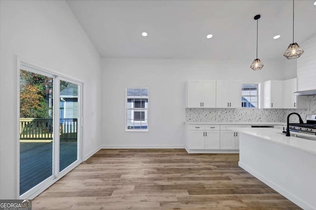 923 Smith St SW, Atlanta, GA 30310 - kitchen featuring a sink, high vaulted ceiling, decorative backsplash, light countertops, and pendant lighting