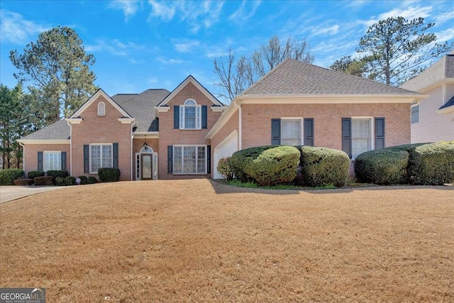 2021 Cockrell Pointe NW, Kennesaw, GA 30152 - traditional-style home featuring brick siding, a front lawn, and a shingled roof