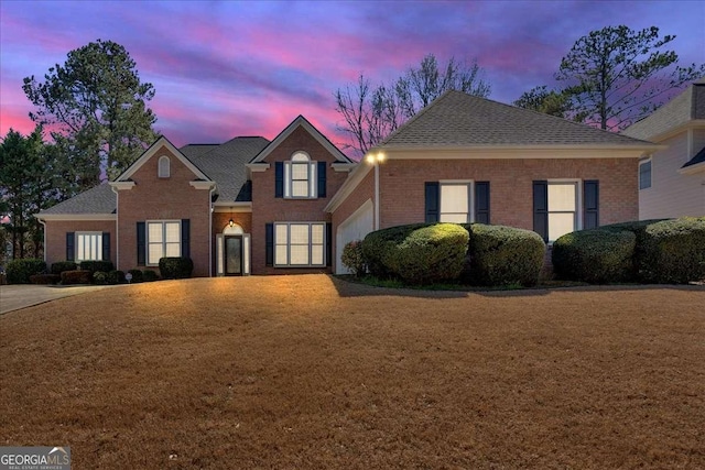 2021 Cockrell Pointe NW, Kennesaw, GA 30152 - traditional-style house with brick siding, a garage, a shingled roof, and a yard