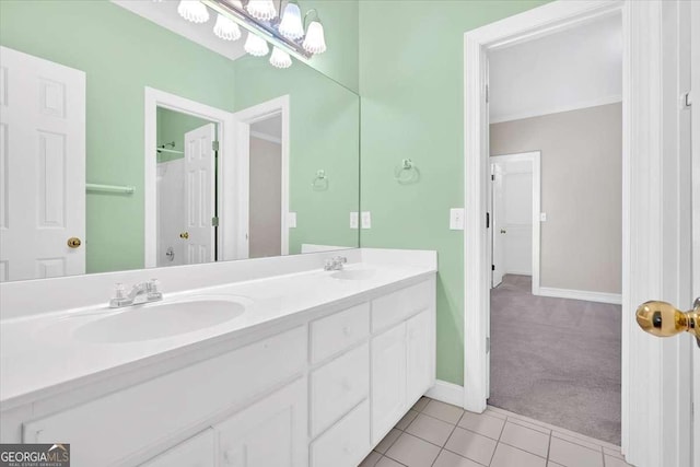2021 Cockrell Pointe NW, Kennesaw, GA 30152 - full bathroom featuring double vanity, tile patterned floors, baseboards, and a chandelier