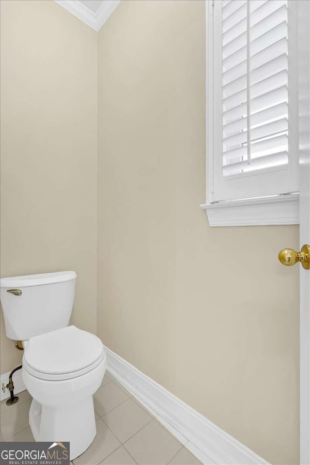 2021 Cockrell Pointe NW, Kennesaw, GA 30152 - bathroom featuring toilet, baseboards, crown molding, and tile patterned flooring