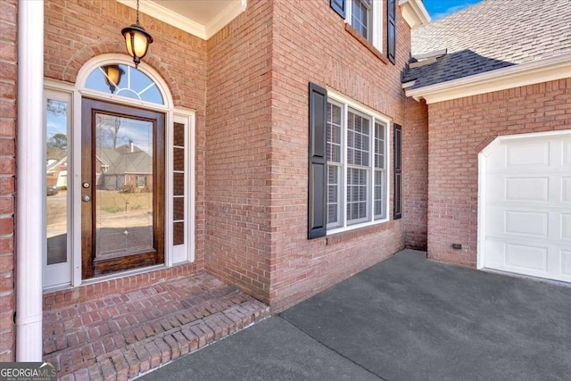 2021 Cockrell Pointe NW, Kennesaw, GA 30152 - doorway to property featuring roof with shingles, brick siding, and an attached garage