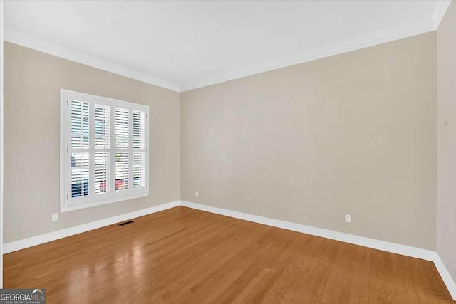 2021 Cockrell Pointe NW, Kennesaw, GA 30152 - unfurnished room with wood finished floors, baseboards, and ornamental molding
