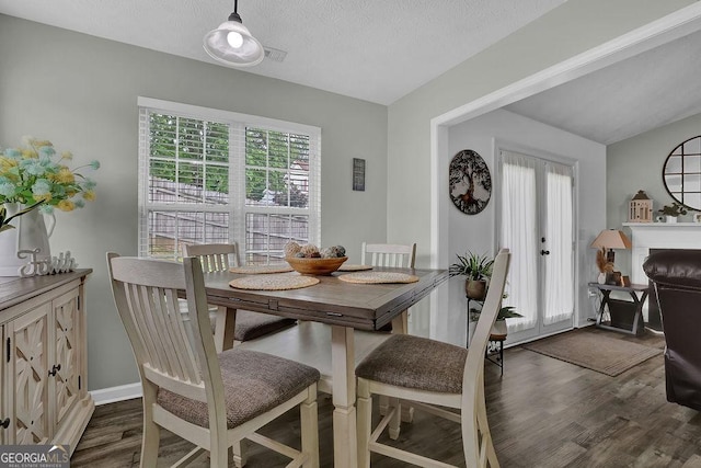 507 Hillcrest Cross Rd, Canton, GA 30115 - dining room with dark wood-type flooring and a textured ceiling