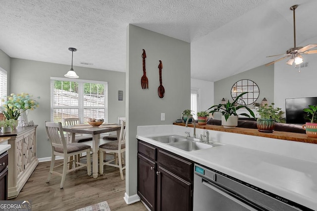 507 Hillcrest Cross Rd, Canton, GA 30115 - kitchen with stainless steel dishwasher, light wood-style flooring, light countertops, a ceiling fan, and pendant lighting