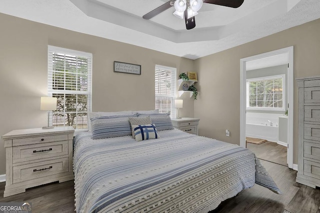 507 Hillcrest Cross Rd, Canton, GA 30115 - bedroom featuring a raised ceiling, wood finished floors, ensuite bathroom, and ceiling fan