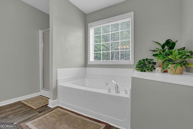 507 Hillcrest Cross Rd, Canton, GA 30115 - bathroom with a bath, a stall shower, and wood finished floors