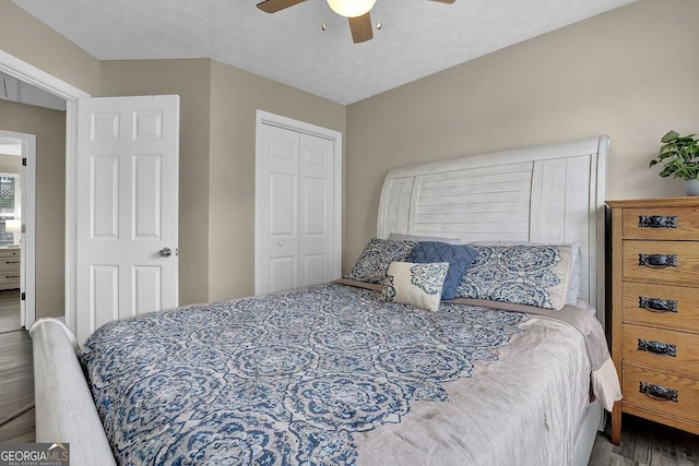 507 Hillcrest Cross Rd, Canton, GA 30115 - bedroom featuring wood finished floors, a closet, and a ceiling fan