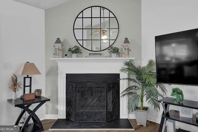 507 Hillcrest Cross Rd, Canton, GA 30115 - living room with wood finished floors, a fireplace with raised hearth, and a ceiling fan