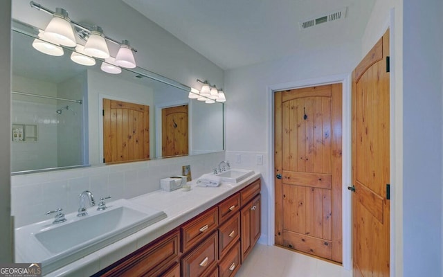 1951 Island View Dr, Hiawassee, GA 30546 - bathroom featuring double vanity, decorative backsplash, and tile patterned floors