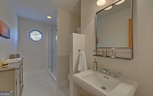 1951 Island View Dr, Hiawassee, GA 30546 - full bathroom featuring a shower stall, tile patterned floors, toilet, a sink, and baseboards