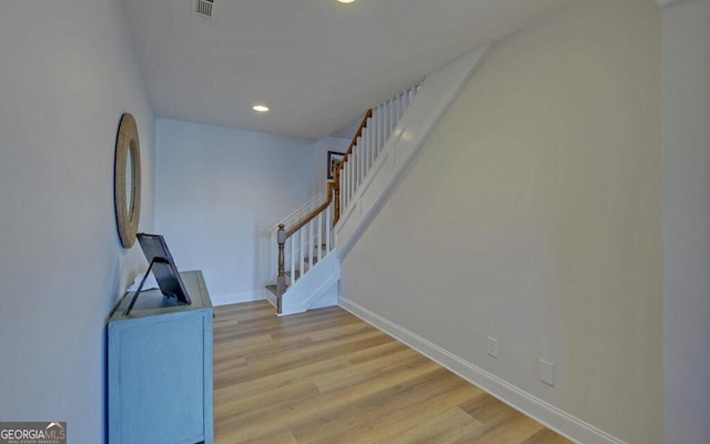 1951 Island View Dr, Hiawassee, GA 30546 - staircase featuring wood finished floors, baseboards, and recessed lighting